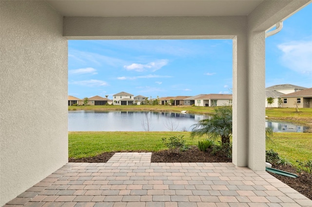 view of patio featuring a water view