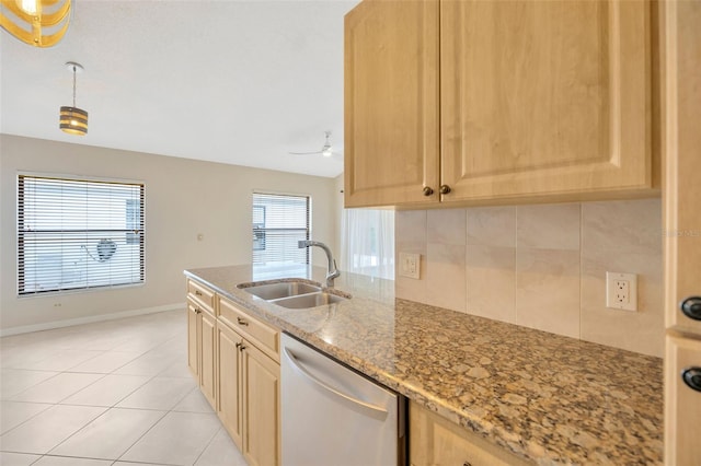 kitchen with light brown cabinets and stainless steel dishwasher