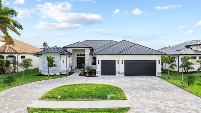 modern farmhouse with a front lawn and a garage