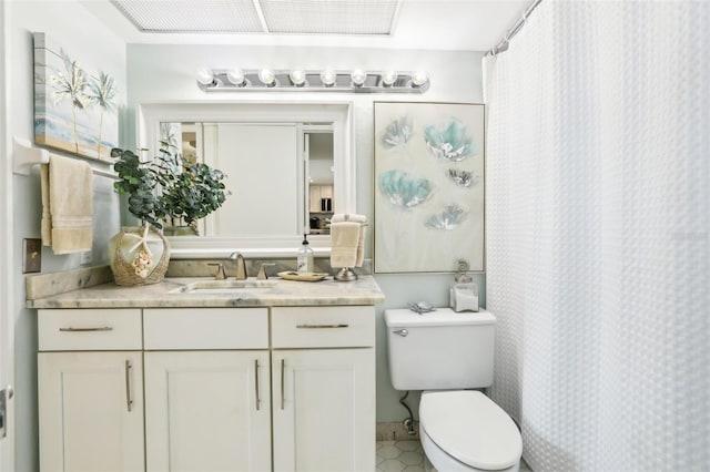 bathroom featuring vanity and toilet