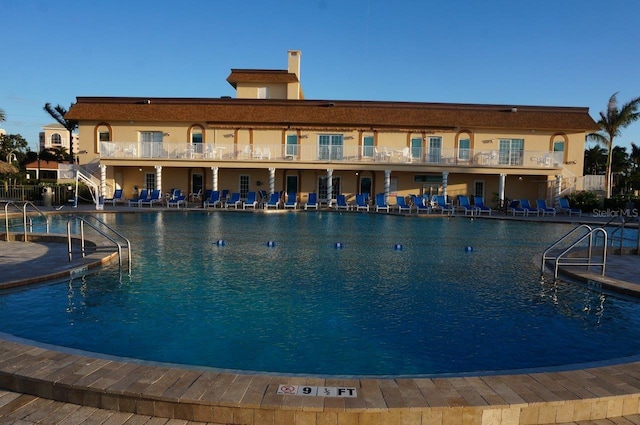 view of swimming pool featuring a patio area