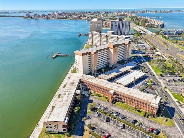 birds eye view of property featuring a view of city and a water view