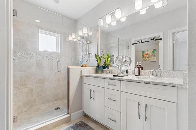 bathroom with vanity and an enclosed shower