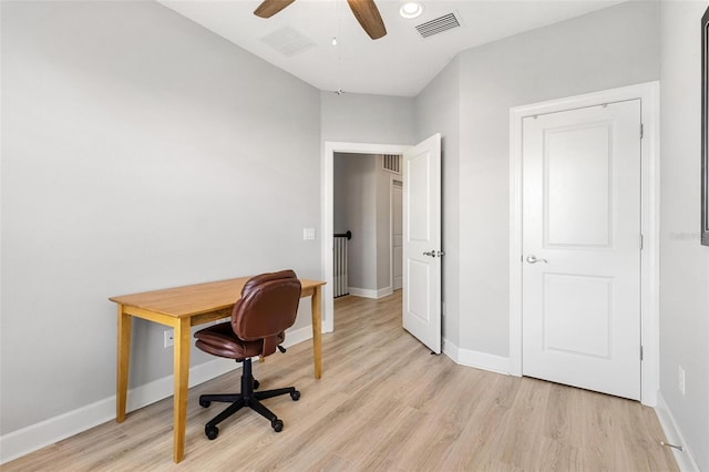 office area featuring light hardwood / wood-style flooring and ceiling fan