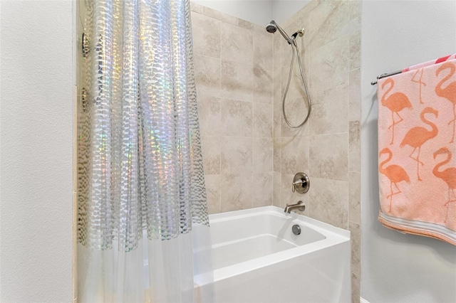 bathroom with shower / bath combo