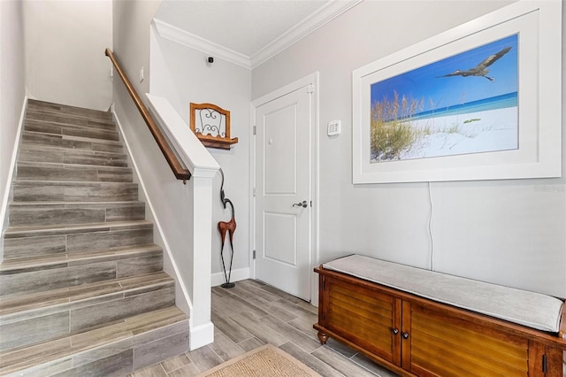 interior space with ornamental molding and light wood-type flooring