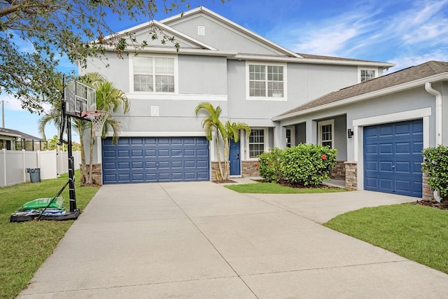 view of front facade with a garage and a front lawn