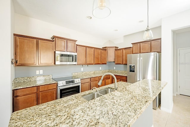 kitchen with a center island with sink, light stone countertops, sink, and appliances with stainless steel finishes