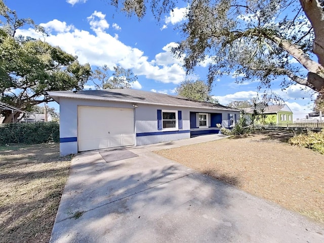 single story home featuring a garage