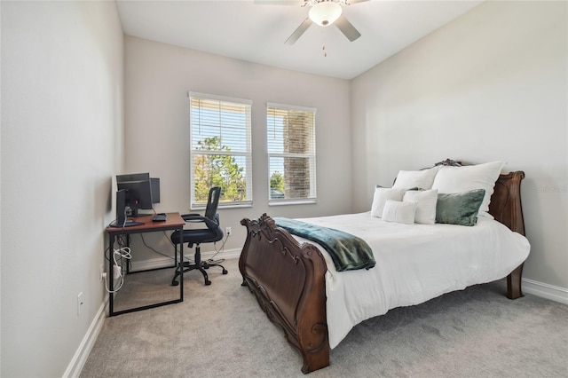 bedroom featuring ceiling fan and light colored carpet