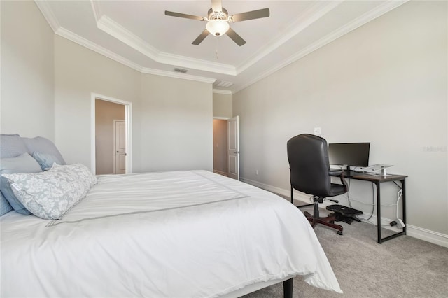 bedroom featuring light colored carpet, a raised ceiling, ceiling fan, and crown molding