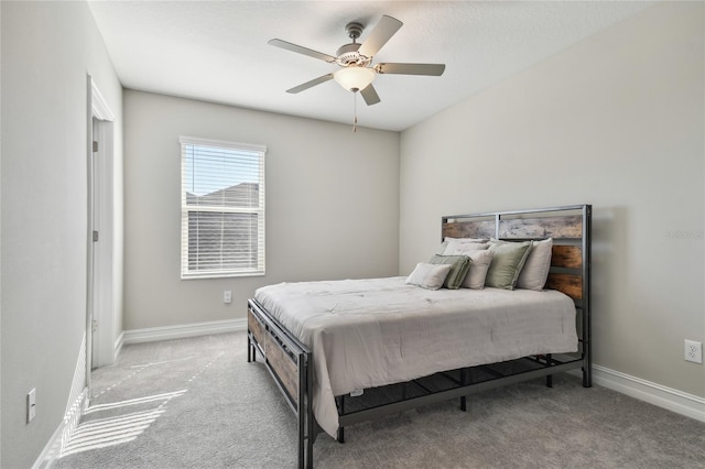 bedroom with light colored carpet and ceiling fan