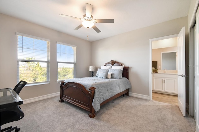 carpeted bedroom featuring ceiling fan and connected bathroom