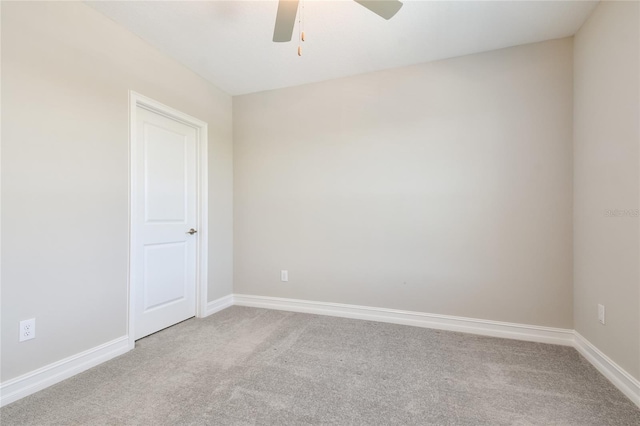 empty room featuring ceiling fan and carpet floors