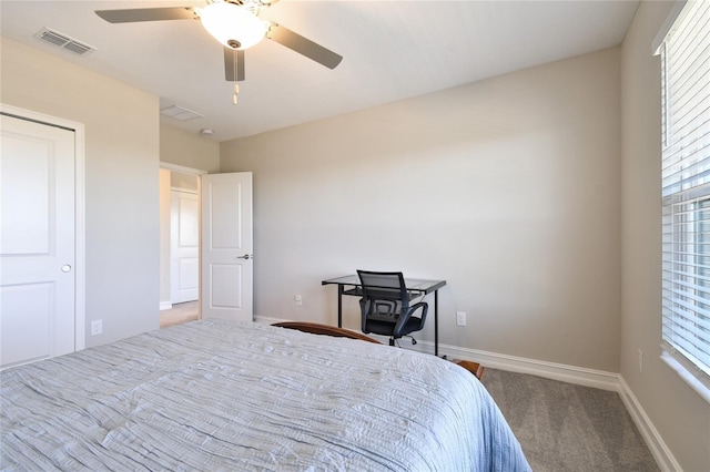 bedroom with ceiling fan and carpet