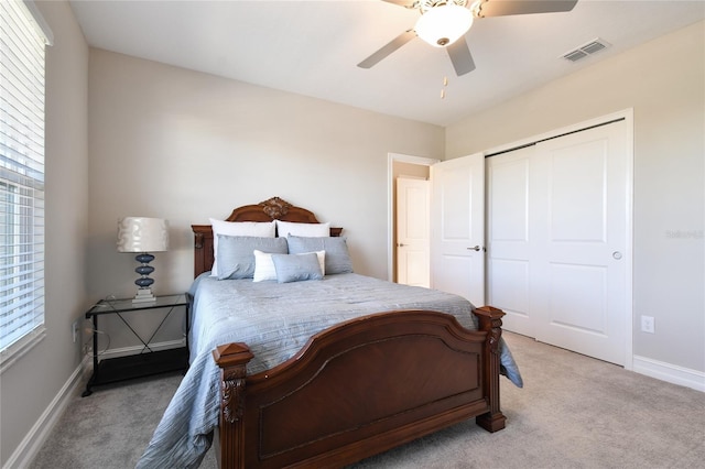 21291 Snowy Orchid Ter, Land O Lakes, FL 34637 - bedroom with light colored carpet, baseboards, a closet, and a ceiling fan