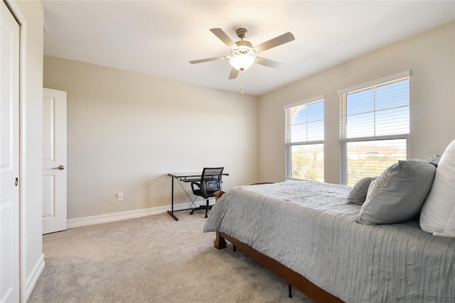 21291 Snowy Orchid Ter, Land O Lakes, FL 34637 - bedroom with light carpet, baseboards, and ceiling fan