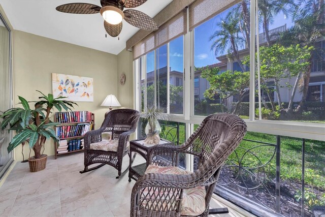 sunroom with ceiling fan and a wealth of natural light