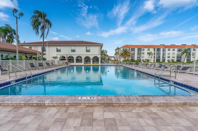 view of swimming pool with a patio area