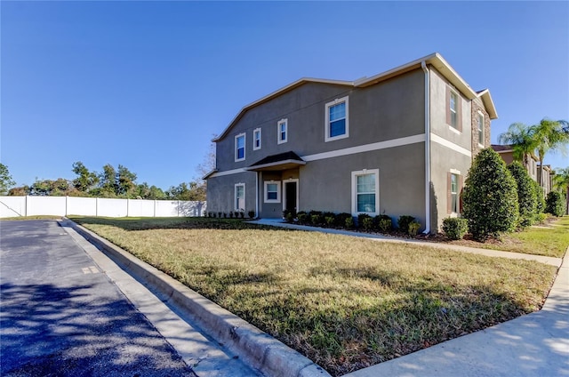 view of front of house featuring a front lawn