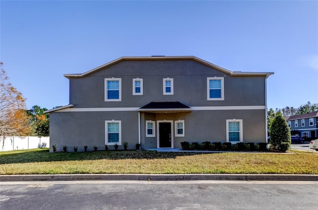 front facade featuring a front yard