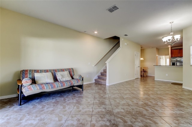 tiled living room featuring a notable chandelier