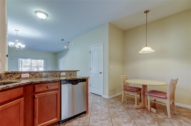 kitchen with dishwasher, an inviting chandelier, hanging light fixtures, light tile patterned floors, and stone countertops