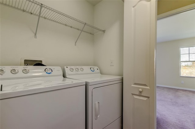 clothes washing area featuring carpet flooring and independent washer and dryer