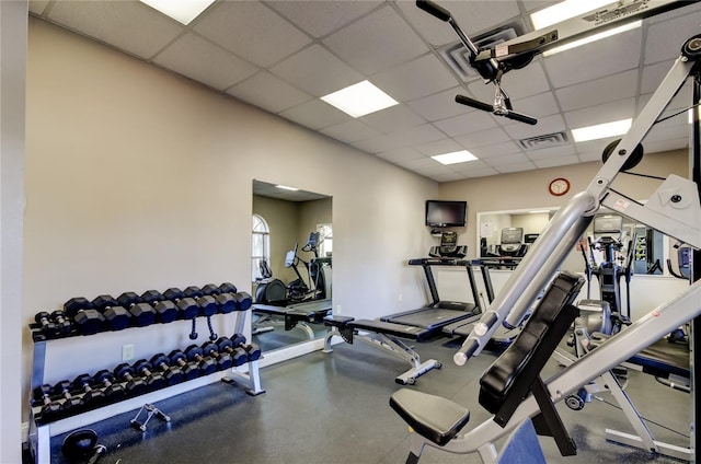 workout area featuring a drop ceiling