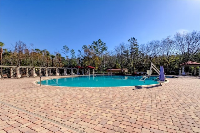 view of swimming pool featuring a gazebo and a patio area