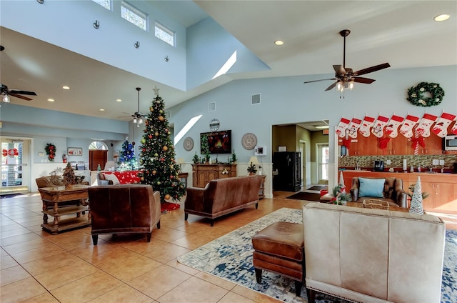 tiled living room featuring high vaulted ceiling