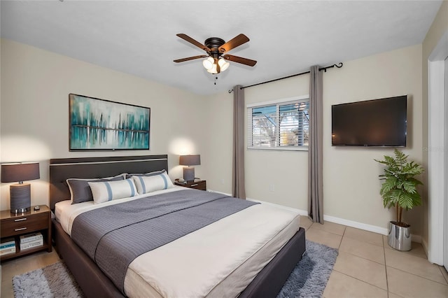 tiled bedroom featuring ceiling fan