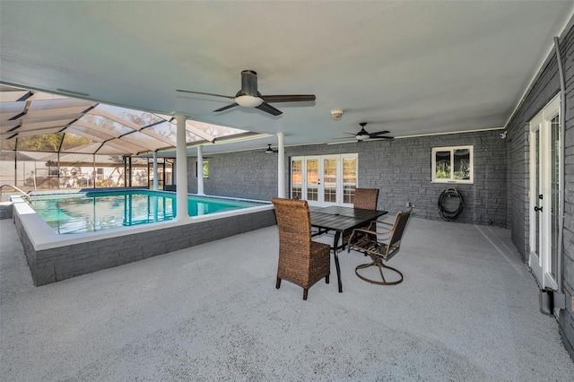 view of swimming pool featuring a patio and a lanai