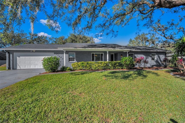 single story home with a front yard and a garage