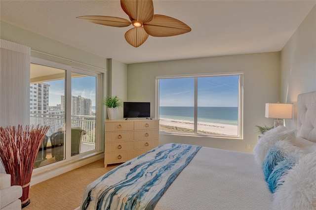 bedroom with ceiling fan, carpet floors, access to outside, and multiple windows