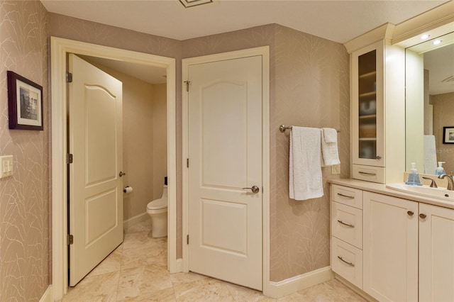 bathroom with vanity and toilet