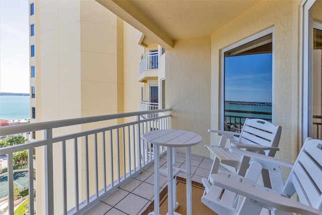 balcony featuring a water view