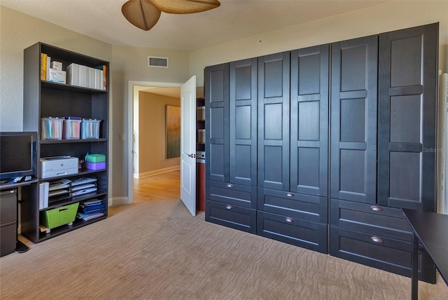 interior space featuring ceiling fan