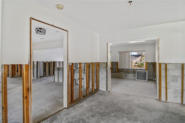 corridor featuring concrete flooring