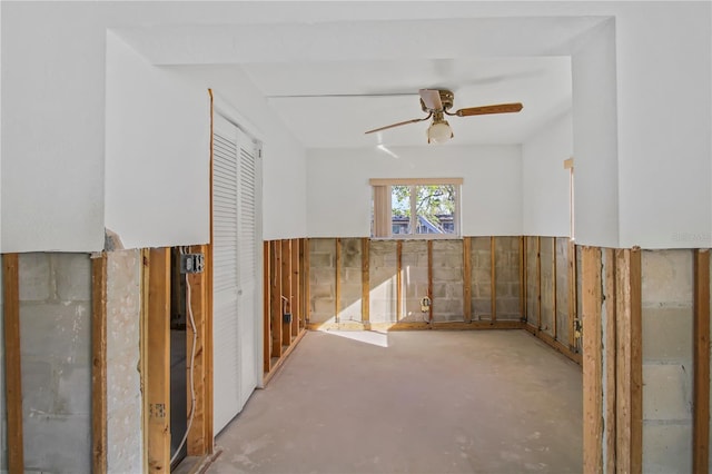 unfurnished room with concrete flooring and ceiling fan