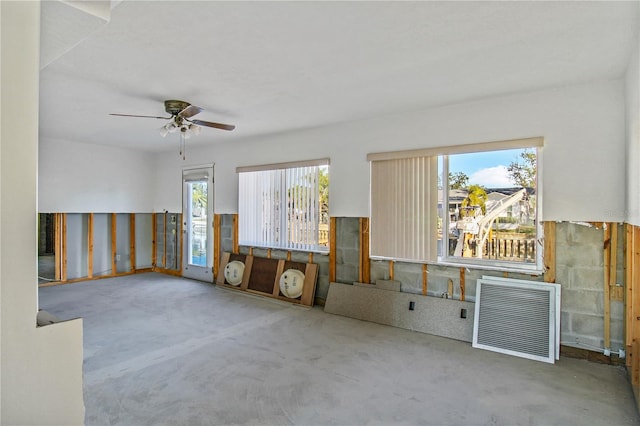 interior space with heating unit and ceiling fan