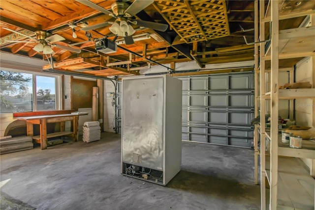 garage featuring ceiling fan and a garage door opener