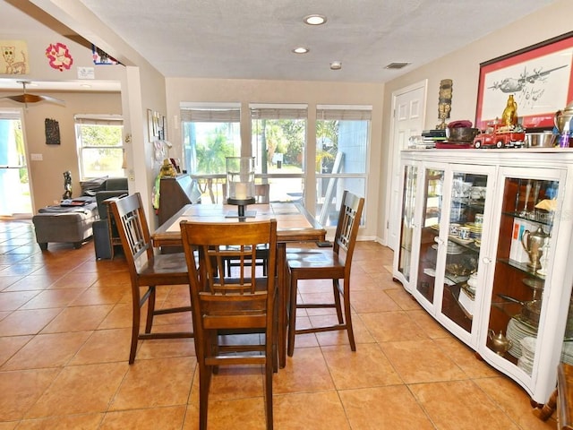 dining area featuring light tile patterned flooring