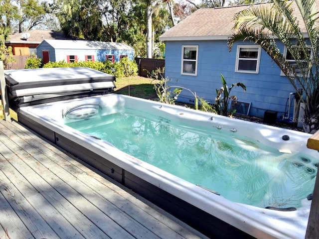 view of swimming pool featuring a wooden deck