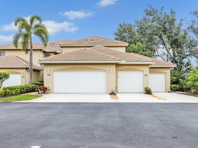 view of front of property with a garage