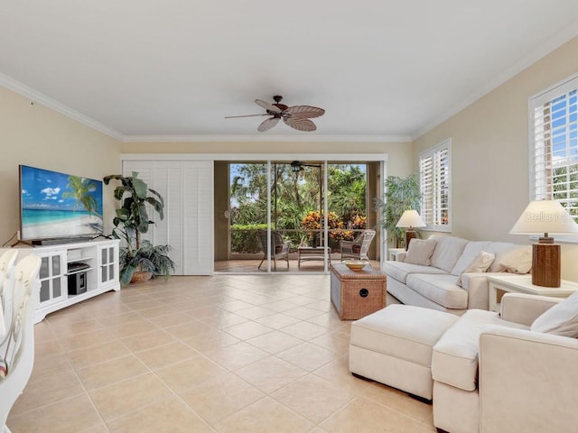 living room with a wealth of natural light, ceiling fan, and ornamental molding