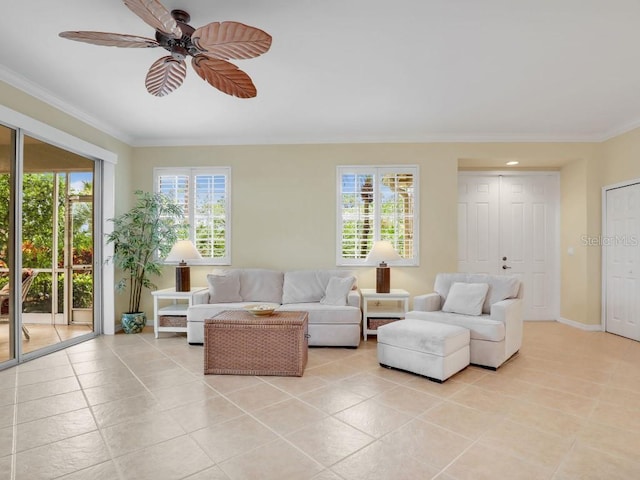 tiled living room with ceiling fan, crown molding, and a wealth of natural light