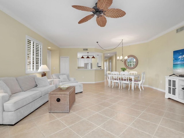 living room with crown molding, light tile patterned floors, a healthy amount of sunlight, and ceiling fan with notable chandelier