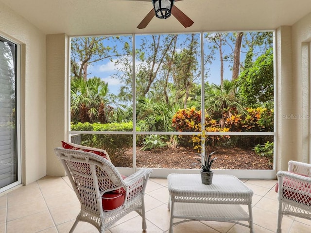 sunroom / solarium featuring ceiling fan