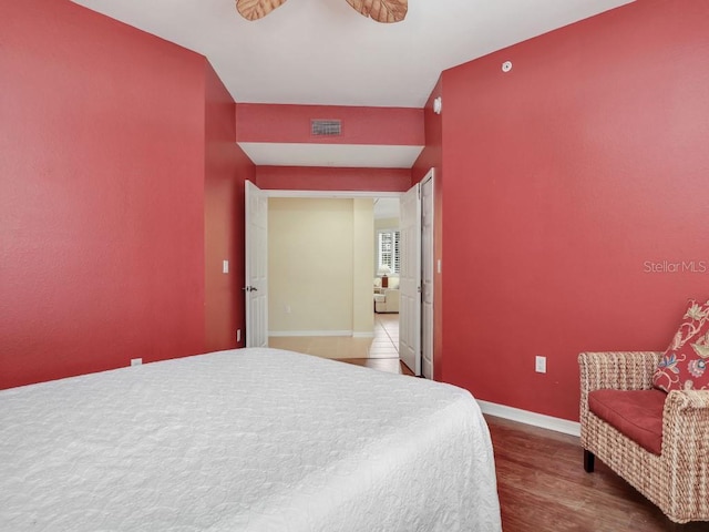 bedroom featuring hardwood / wood-style floors and ceiling fan